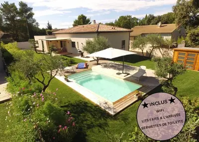 a swimming pool in the yard of a house at 3 bedrooms new house with heated swimming pool in Carpentras