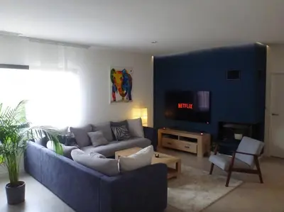 a living room with a couch and a tv at 3 bedrooms new house with heated swimming pool in Carpentras