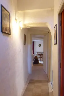a hallway leading to a room with at Au Bregnat Vue du mont Ventoux in Bédoin