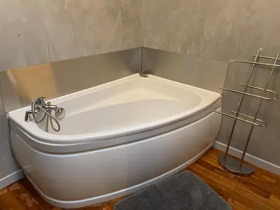 a white toilet in the corner of a room at LA BASTIDE FERREOL in La Motte-dʼAigues