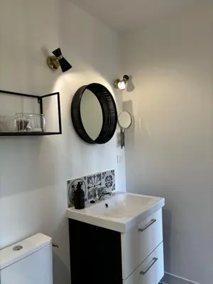 a bathroom with a sink and a mirror on the wall at Joli gite en Provence avec piscine in Aubignan