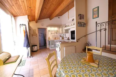 a kitchen and dining room with a table in a room at pretty detached villa with private swimming pool, in Aureille, in the alpilles - 8 people in Aureille