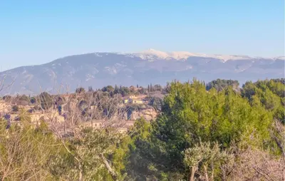 a view of a hill with mountains in the background at Nice Home In La-Roque-Sur-Pernes in La Roque-sur-Pernes