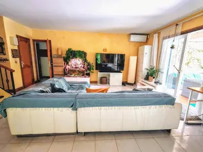 a large bed in a room with a tv at BELLE VILLA Piscine 120 m2, 8 pers, 3 belles chambres Près d'Aix-en-Provence in Ventabren