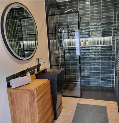 a bathroom with a sink and a shower at Le Cocoon - Jacuzzi, Sauna et Piscine privée in Carpentras