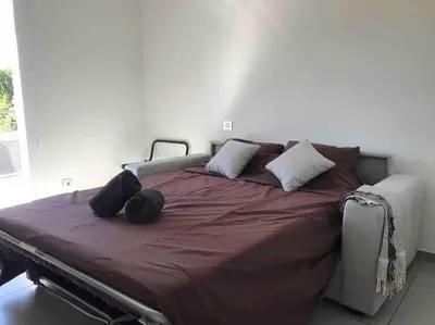 a bedroom with a large bed with pillows on it at Magnifique villa avec piscine Mt Ventoux Provence in Carpentras