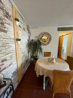 a dining room with a table and chairs at En Provence chez Valérie in Cavaillon