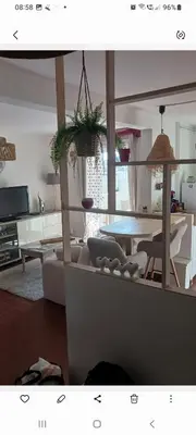 a living room with a couch and a table at En Provence chez Valérie in Cavaillon