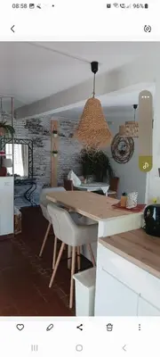 a dining room with a wooden table and chairs at En Provence chez Valérie in Cavaillon