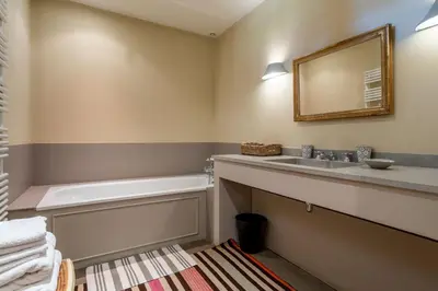 a bathroom with a sink and a bath tub at Les Deux Mas in Lagnes