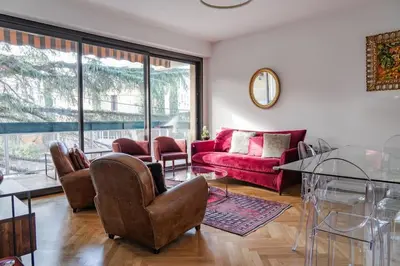 a living room with a red couch and chairs at T3 Centre ville Aix-en-Provence in Aix-en-Provence