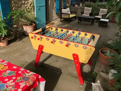 a ping pong table with a game of chess at Superbe mas proche centre-ville in Salon-de-Provence