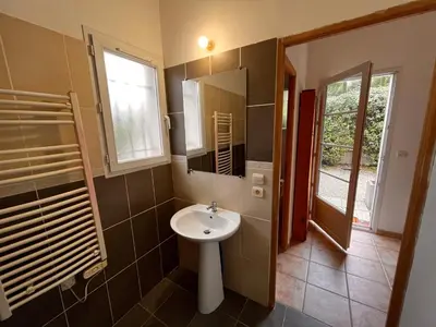 a bathroom with a sink and a mirror at LES VIEUX CABASSOLS VENELLES in Venelles