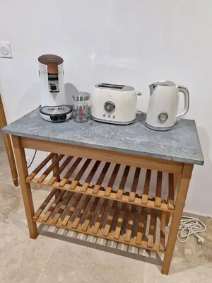 a table with two appliances on top of it at Appartement de caractère - CARPENTRAS - Rendez-vous en Provence in Carpentras