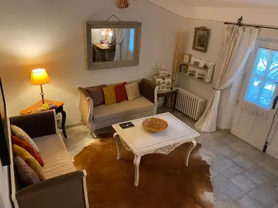 a living room with a couch and a table at Mas de la Beaume in Gordes