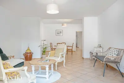 a living room with chairs and a table at Maison Alena Lourmarin Main Square in Lourmarin