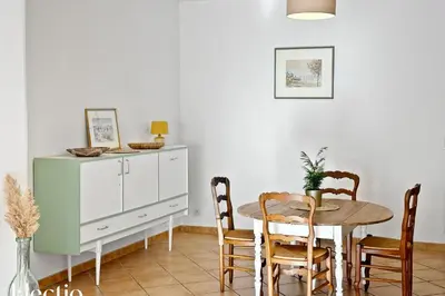 a dining room with a table and chairs at Maison Alena Lourmarin Main Square in Lourmarin