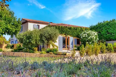 a house with a garden in front of it at Appartement I Bastide La Gravière I Electio in Lourmarin