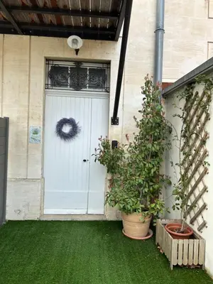 a white door with a wreath on it at Détours en Provence - Lavande 3* in Châteaurenard
