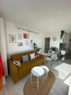 a living room with a couch and a table at Charmant Studio à 5 min d’Aix en Provence in Aix-en-Provence