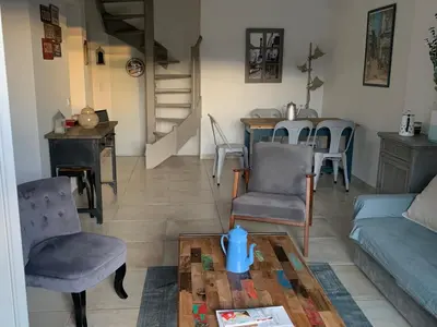 a living room with a couch and chairs and a table at Maison de charme à Lourmarin in Lourmarin