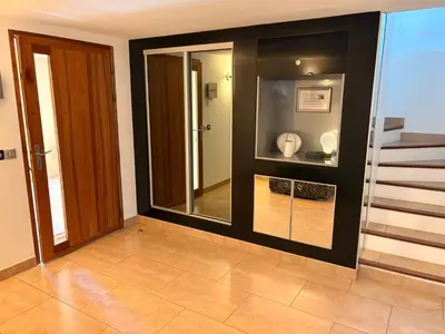 a room with a glass door with a bathroom at la grande villa in Aix-en-Provence