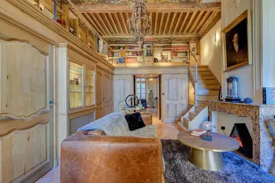 a bedroom with a bed and a fireplace at Maison des Arts Aix en Provence Apartment in Aix-en-Provence