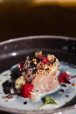 a plate of food with meat and berries on it at Domaine Gao in Aix-en-Provence