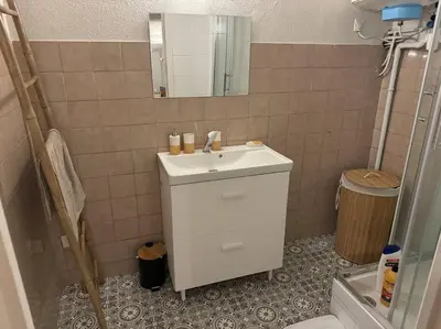 a bathroom with a sink and a mirror at Carpentras cosy& 3 voyageurs& in Carpentras