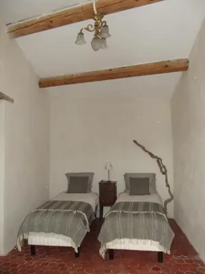 two beds in a room with a ceiling at LE GRAIN DE LAVANDE - Mont Ventoux in Sault-de-Vaucluse