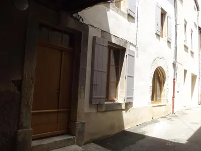 a building with a door and a window on a street at LE GRAIN DE LAVANDE - Mont Ventoux in Sault-de-Vaucluse