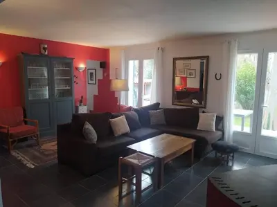 a living room with a couch and a table at Maison en Provence in Entraigues-sur-la-Sorgue