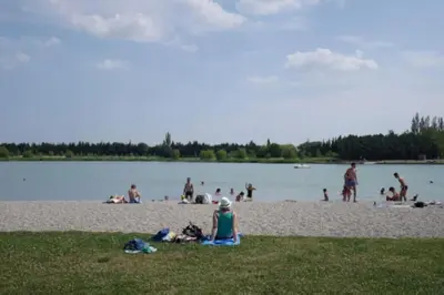 a group of people on the beach at a lake at Maison en Provence in Entraigues-sur-la-Sorgue