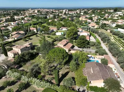 an aerial view of a residential neighborhood with a house at The Olive Garden - Charming Villa for 10 with pool and fast Wifi in Caromb
