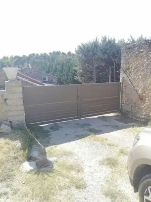 a wooden fence in front of a house at Bedoin Mas PASEVE in Bédoin