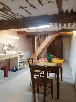 a dining room with a table and chairs and a staircase at Bedoin Mas PASEVE in Bédoin