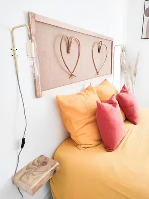 a bedroom with a bed with two hearts on the wall at Le Cosy Valcros, design et confort in Aix-en-Provence