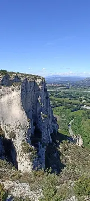an aerial view of a rocky mountain with a road at 2 chambres au calme Villa Chrisma Provence in Orgon