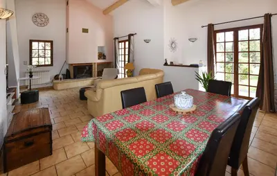 a living room with a table with a tablecloth on it at Stunning Home In Loriol-Du-Comtat in Loriol-du-Comtat