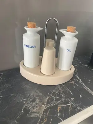 a counter with two white containers on a counter top at maison_du_sud_13140 in Miramas