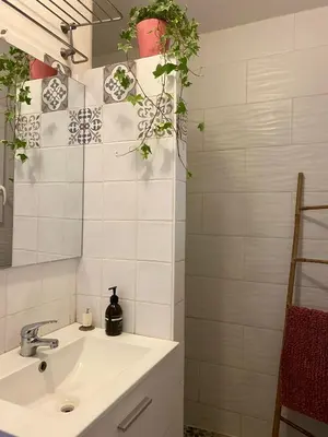 a bathroom with a sink and a mirror at Au pied du luberon in Pertuis