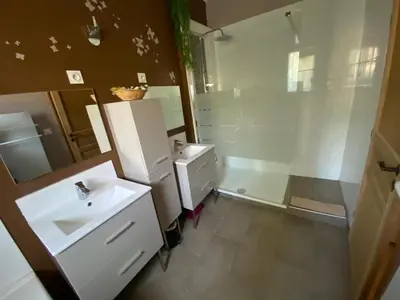 a white bathroom with a sink and a shower at Le bon Vivre in Aix-en-Provence