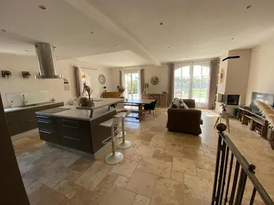 a large kitchen and living room with a table at Le bon Vivre in Aix-en-Provence