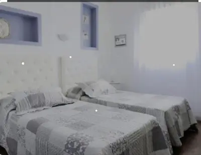 a room with two beds in a room at Luberon family in Apt