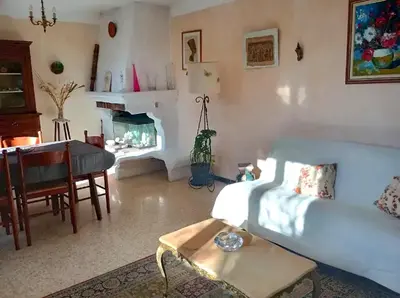 a living room with a couch and a table at Appartement charmant à Aix-en-Provence - 48m² - Balcon privé in Aix-en-Provence