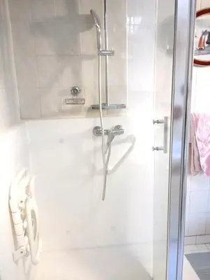 a shower with a glass door in a bathroom at Appartement charmant à Aix-en-Provence - 48m² - Balcon privé in Aix-en-Provence
