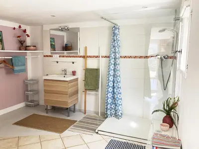 a bathroom with a sink and a shower at Les Lavandes in Saignon