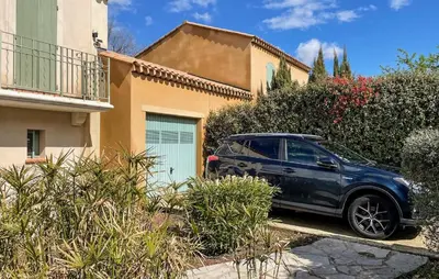 a blue car parked in front of a house at Awesome Home In Saint-Rémy-De-Provence in Saint-Rémy-de-Provence