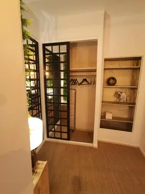 a hallway with a sink and a mirror at Appartement centre historique Aix en Provence, Place RAMUS in Aix-en-Provence