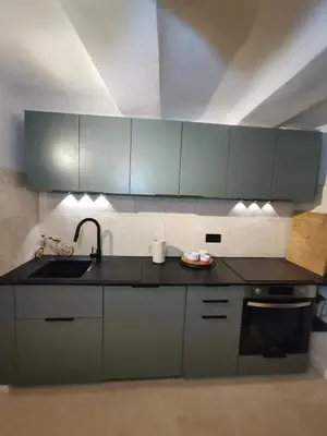 a kitchen with gray cabinets and a sink at Appartement centre historique Aix en Provence, Place RAMUS in Aix-en-Provence